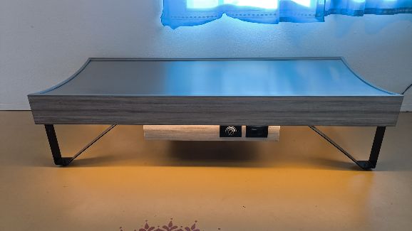 The Quantum Energy Wellness Bed in the room, with soft light underneath